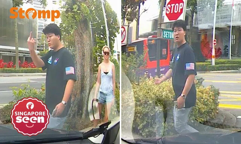 pedestrian points middle finger
