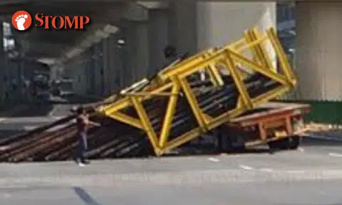 Heavy load falls off truck after driver allegedly failed to slow down while turning at Pioneer Rd