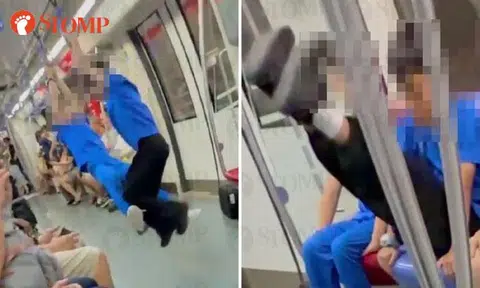 Schoolboys swing from handles, treat train like playground