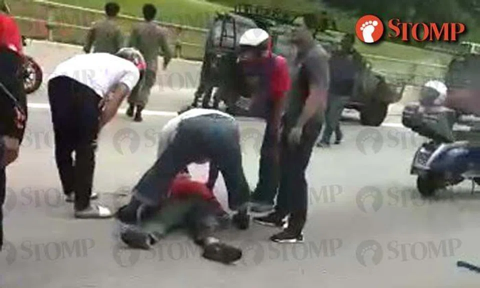 Man lies motionless while motorists tend to him on TPE