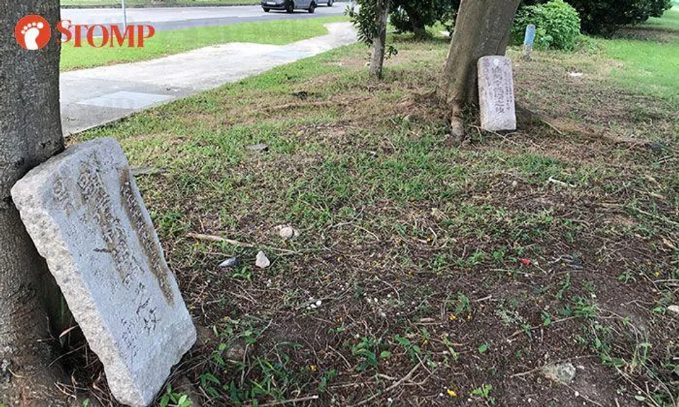 Why are there tombstones behind this bus stop at Xilin Ave?