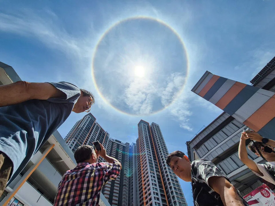 Onlookers taking photos of a sun halo at Clementi on Aug 25. 