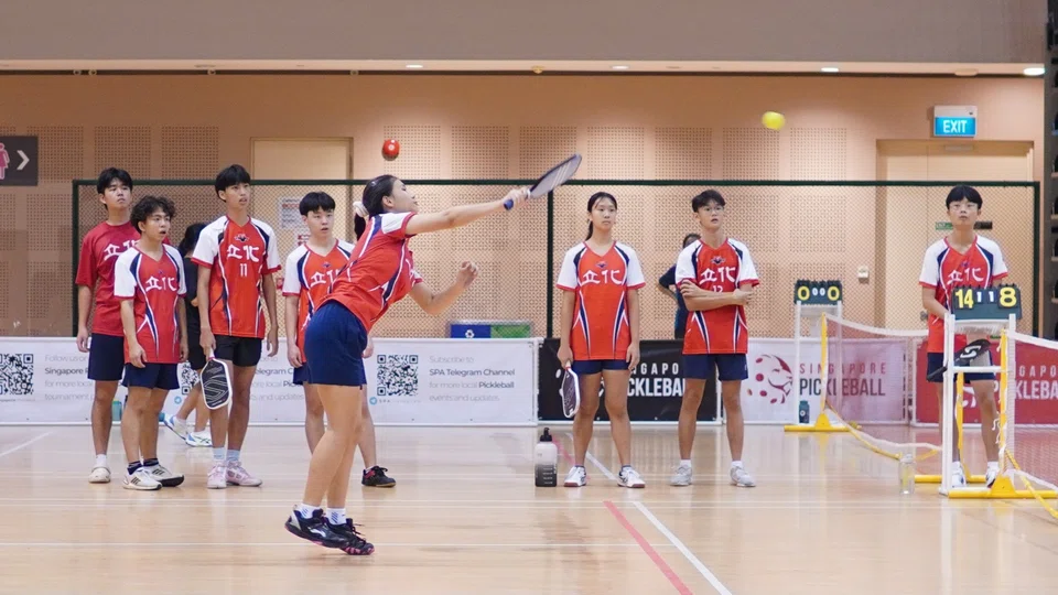 Students from River Valley High School look on as their schoolmate plays in a match at the Inter-School Pickleball Tournament on May 10. 