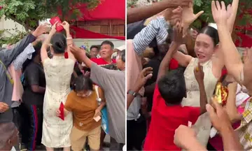 Woman distributes red packets outside Penang temple, sustains foot injury after getting mobbed