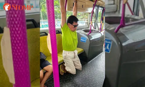 Man hangs from grab pole on bus for 'on and off 15 min like a child'