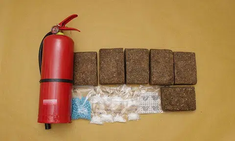 About 4,517g of cannabis was concealed inside a hollowed-out fire extinguisher. PHOTO: CNB
