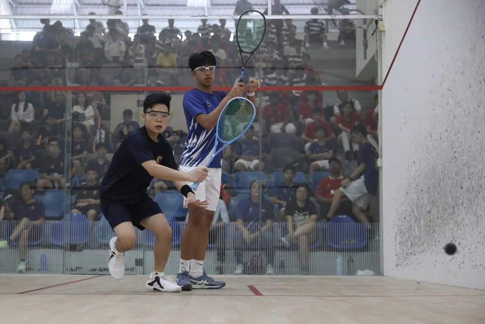 Ethan Tan (left) plays against Richard Allan Durrani (right) in the second match of the final.