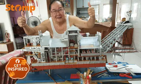 Stomper Rak Cheong's father posing with a ship model, which can take years to complete.