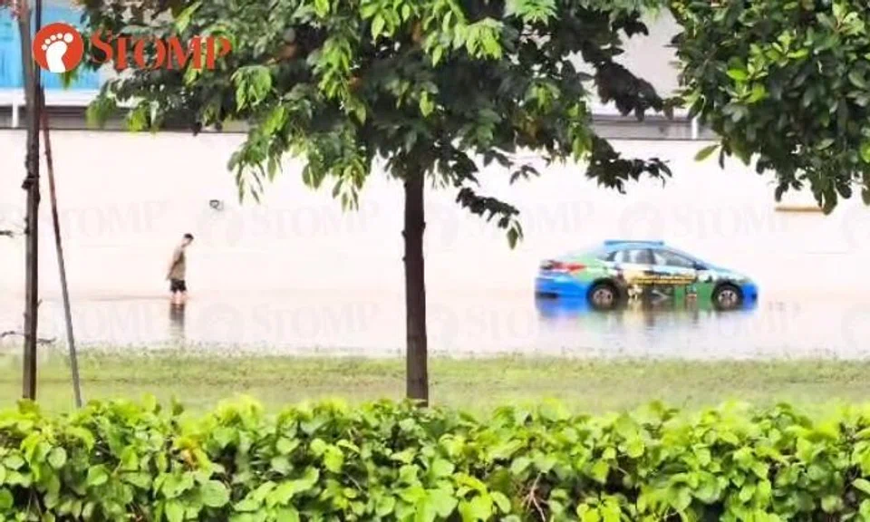 Man wades through thigh-deep floodwater in Marina Bay area after monsoon surge: 'S'pore got river taxi?'