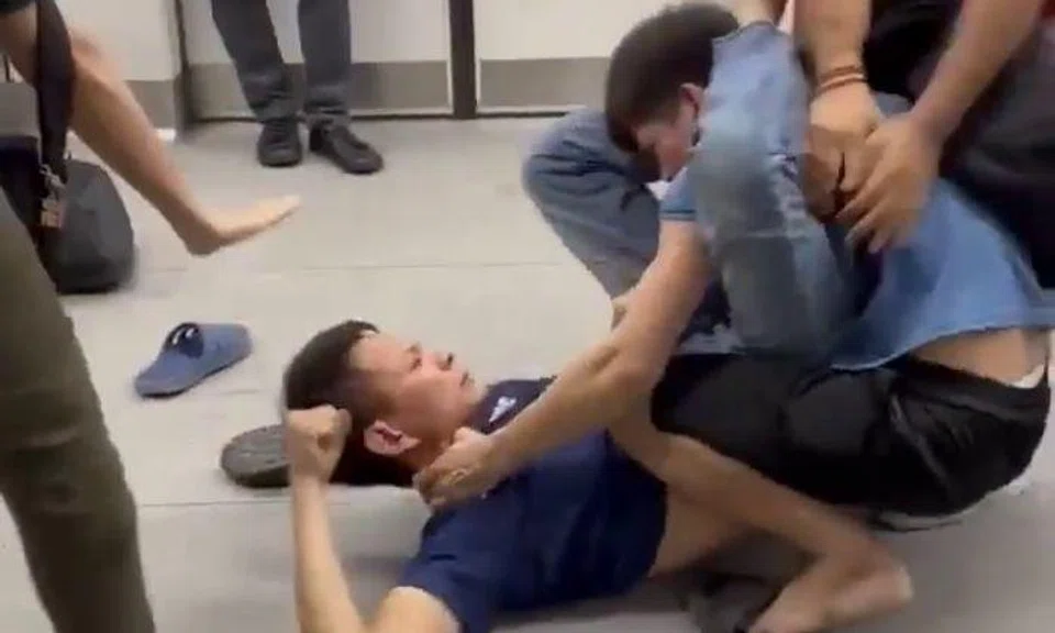 Videos of the fight that were circulated on social media on Friday show a man in a dark blue shirt sprawled on the floor of the train, punching and kicking the other man, who is wearing a light blue shirt.