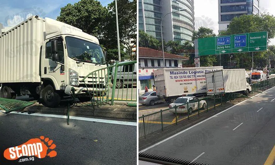 Lorry smashes through road divider at Macpherson Rd