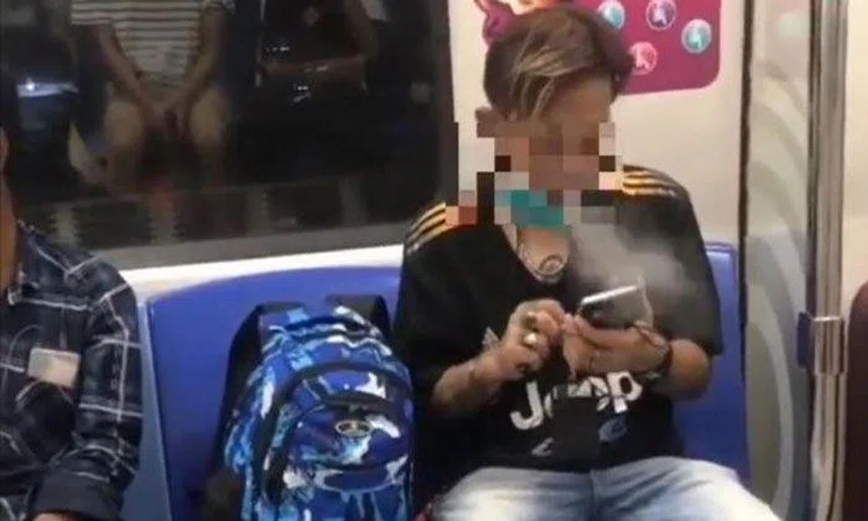 A video circulating on Instagram showed the man's mask pulled down to his chin as he puffed on an e-cigarette and used his phone. PHOTO: SCREENGRAB FROM SGFOLLOWSALL/INSTAGRAM