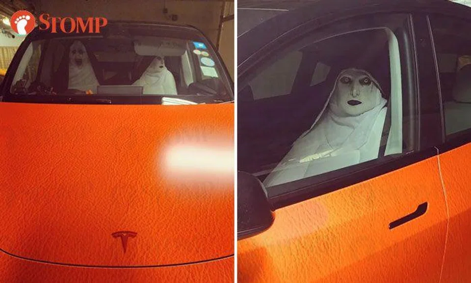 Tesla decked out with terrifying nun seat covers grabs attention of passers-by