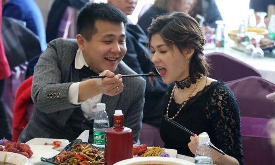 Russian beauty marries Chinese coal miner -- even though he has no house, car or savings