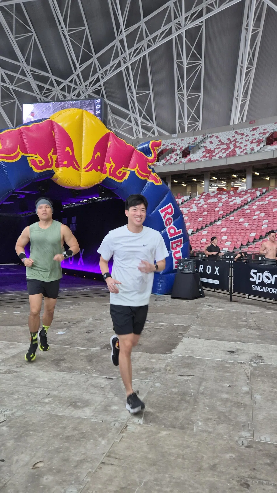 Mr Zachary Young (right), who has completed two Hyrox races, says the finisher patch is a smart marketing move as it can be attached to bags and caps and worn daily. 