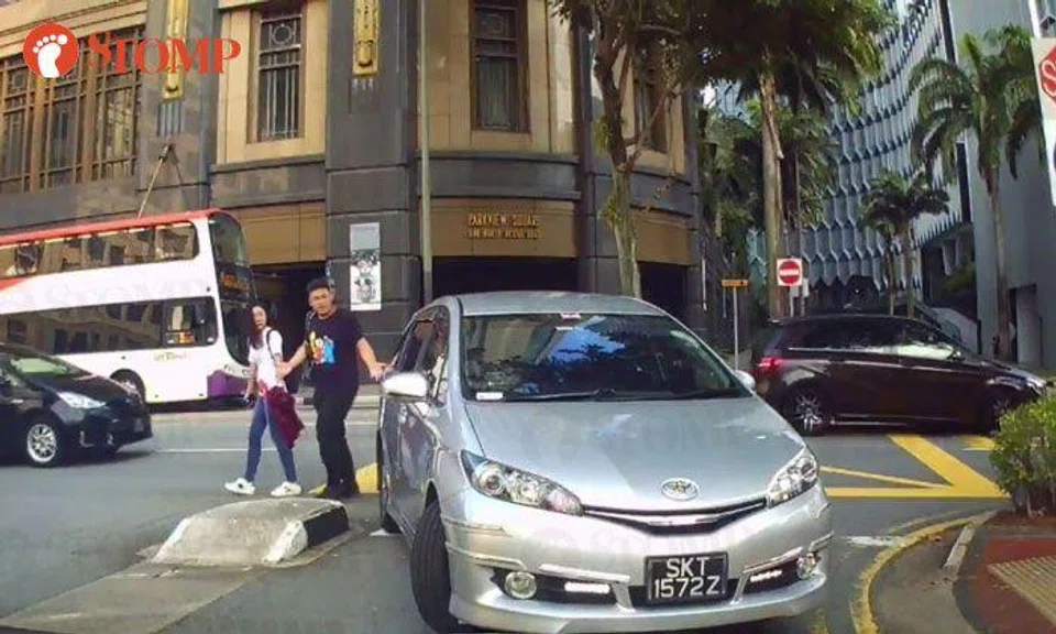 Driver makes wrong turn into North Bridge Rd carpark, then almost reverses into couple