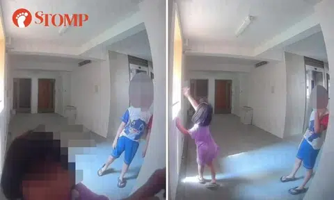 Little girl takes hook on gate and throws it down block