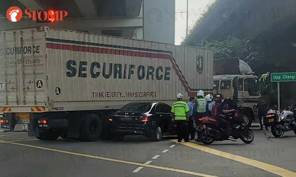 Trailer driver assisting with investigations into accident with car at Upper Changi East junction