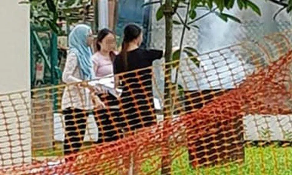 The three women were spotted burning documents in an offering bin. 