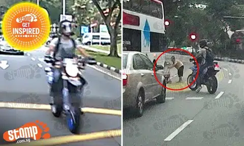 Superhero of Bishan uses himself and bike to stop traffic -- for old lady to cross road