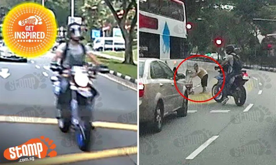 Superhero of Bishan uses himself and bike to stop traffic -- for old lady to cross road