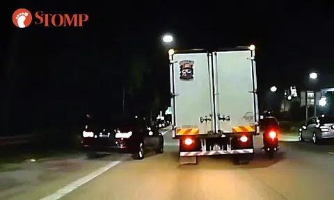 M'sian BMW driving out of road shoulder nearly causes accident with truck, motorcycle on BKE
