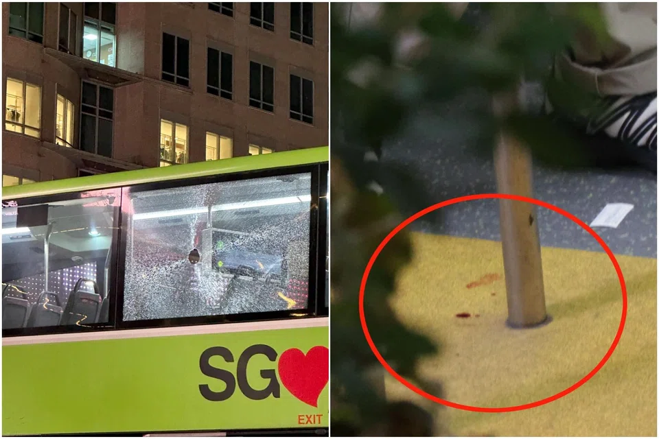 Someone, believed to be a person in the street, threw a bottle at the bus that left a hole in its window.