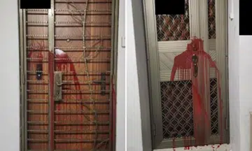 Red paint on doors part of alleged loan shark harassment incident