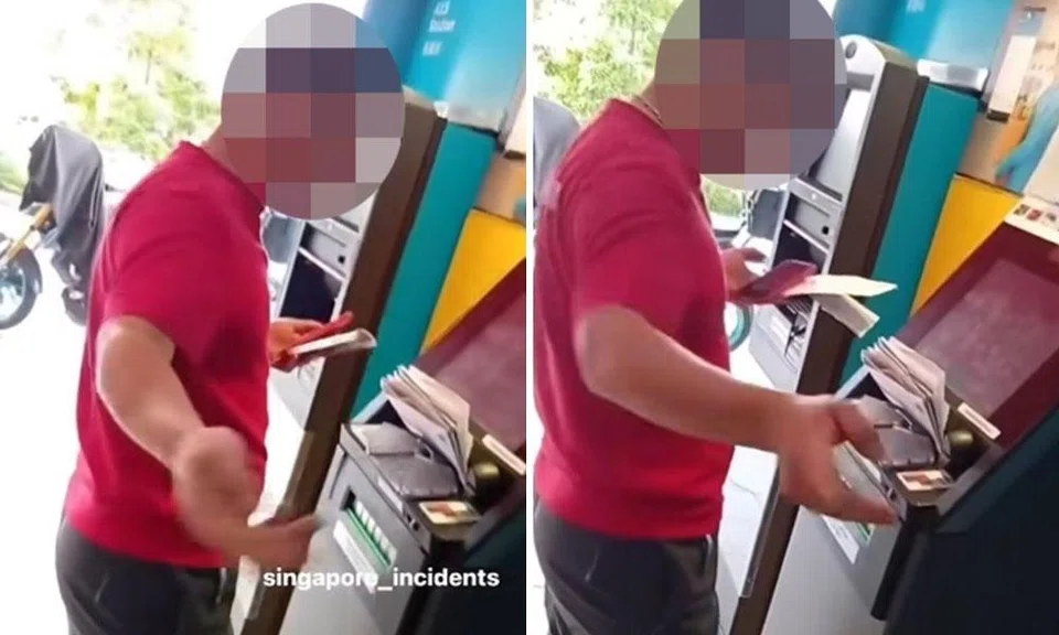 The man at the ATM with a stack of documents at the console.