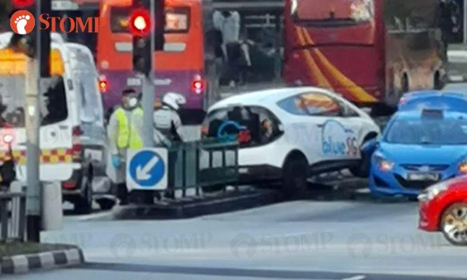 BlueSG car mounts road divider in accident with taxi at Upper Serangoon Road