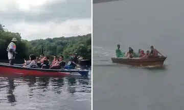 As the fast-moving boat turned a corner, it capsized in the middle of the river, trapping everyone on board underneath the overturned vessel.