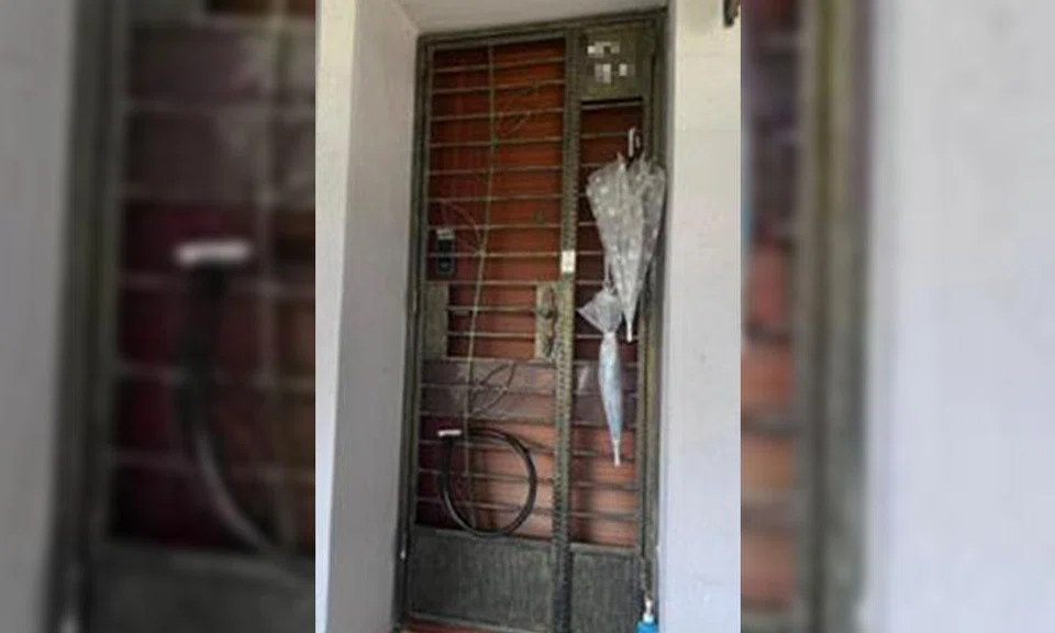 50 year old woman arrested after locking jurong east unit gate with bicycle lock