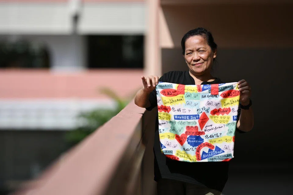 Madam Tay Bee Lian, 73, illustrated the Mandarin phrase for “How are you?” as part of the Openness artwork.
