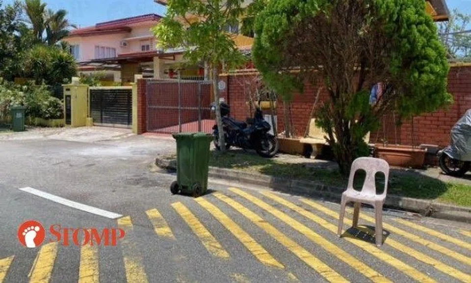 Chair, rubbish bin used to chope parking space in Bedok private estate: 'Inconsiderate and illegal'