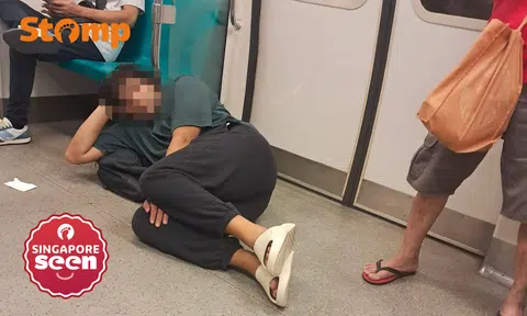 Man lies on MRT floor, obstructing passengers