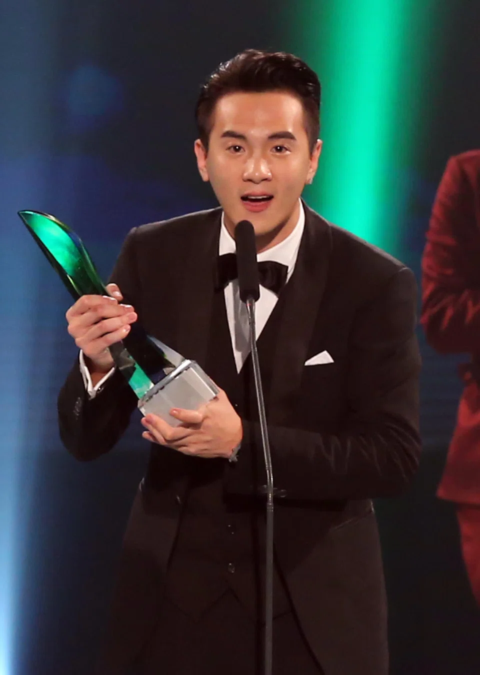 Fang receiving the Top 10 Most Popular Male Artist award at the Star Awards in 2015. PHOTO: TNP FILE
