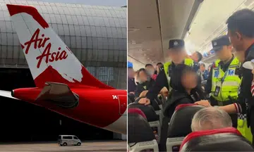 AirAsia passenger scolds air crew for not speaking Mandarin. 