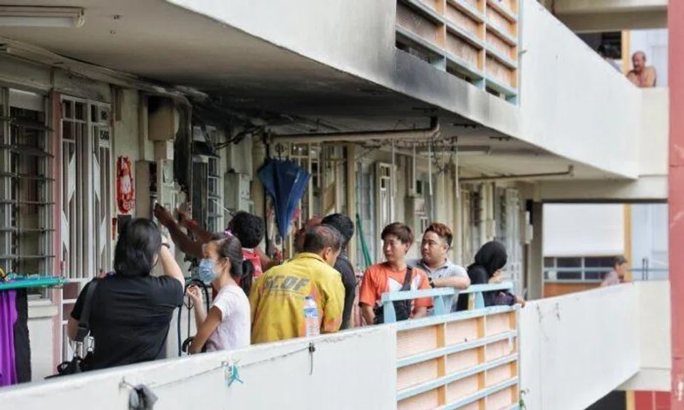 Shin Min reported that three people – Mr Tan’s wife and their two children – ran out of the flat after smoke started coming out. Moments later, the air-conditioner exploded, eyewitnesses said. Photo: Shin Min Daily News