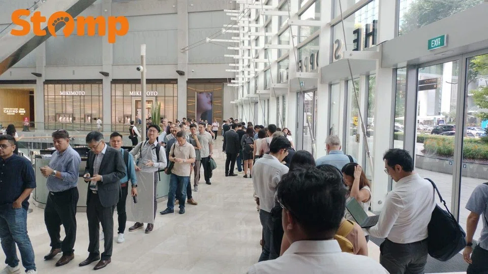  People lining up from the expo halls to the shopping area at MBS.