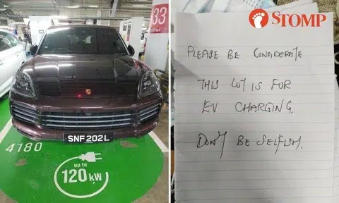 A Porsche Cayenne in a parking space meant for only electric vehicles (EV) at 