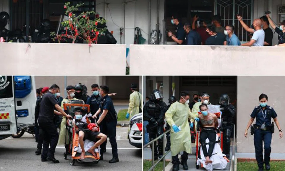 The two men had locked themselves in a flat together with their 77-year-old mother. PHOTOS: SHIN MIN DAILY NEWS