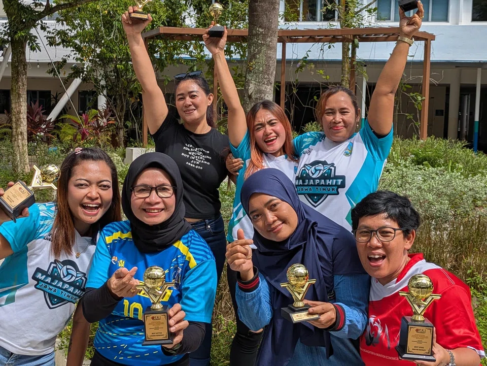 Ms Istriyanti (foreground, right) organises volleyball tournaments for domestic workers on alternate Sundays.