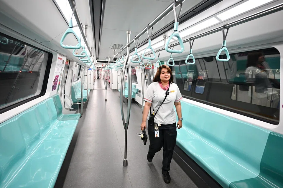 As part of her duties, train captain Munirah Zulkepli, 29, needs to walk from one end of the train to the other to conduct checks - including the testing of brakes and opening or closing of doors - before launching it for operations. 