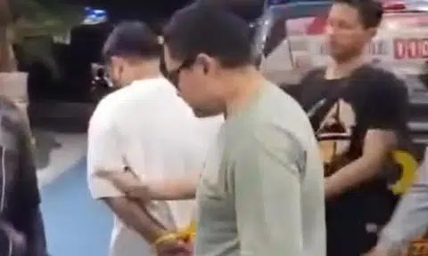 Police said the Singaporean man (in white) had tried to flee towards Sanur before he was arrested.