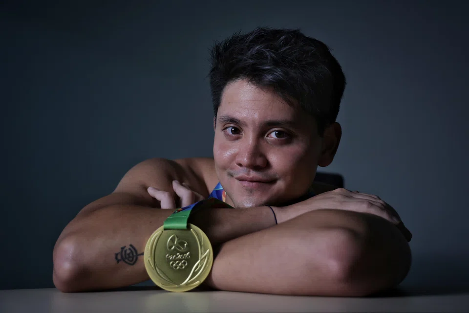 Joseph Schooling with his Olympic gold medal singapore biggest stories