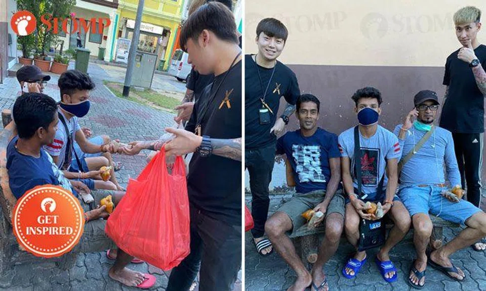 Thumbs up! Men give out prata to workers in Little India as gesture of appreciation