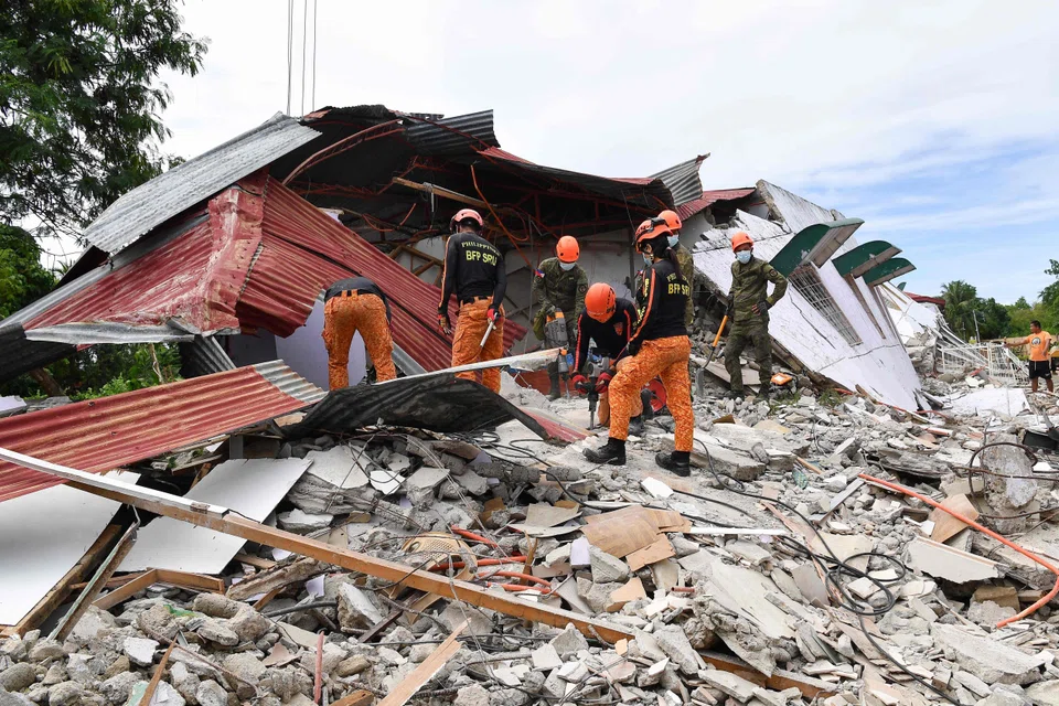 Rescuers searching for three people who were reported missing under the rubble of a collapsed building in Bogo City.