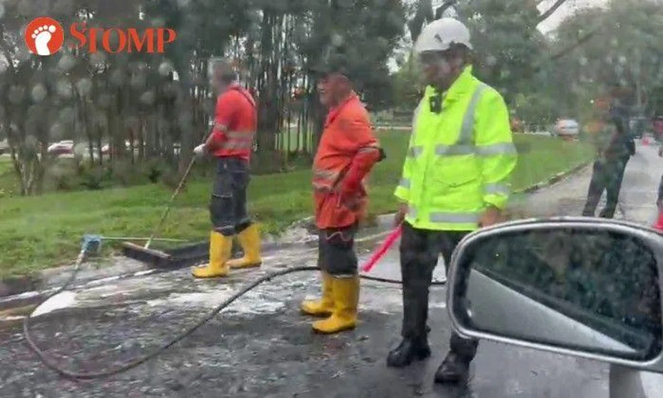 The videos show that one of the two lanes was closed, causing a traffic jam. Police were at the scene and workers appeared to be washing the road.
