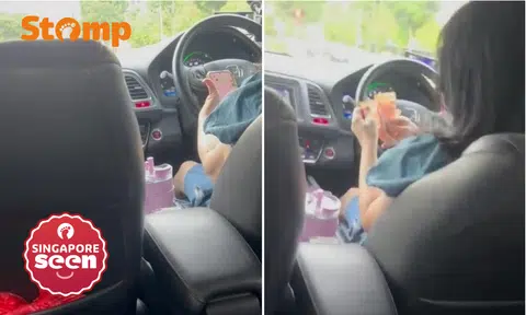 PHV driver uses phone and handles cash while driving, gets 'formal warning' from Tada