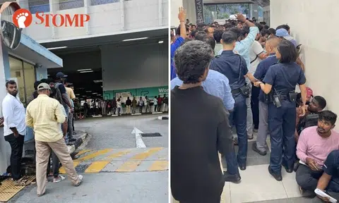 Police called after scuffles break out among foreign workers in massive queue at driving centre